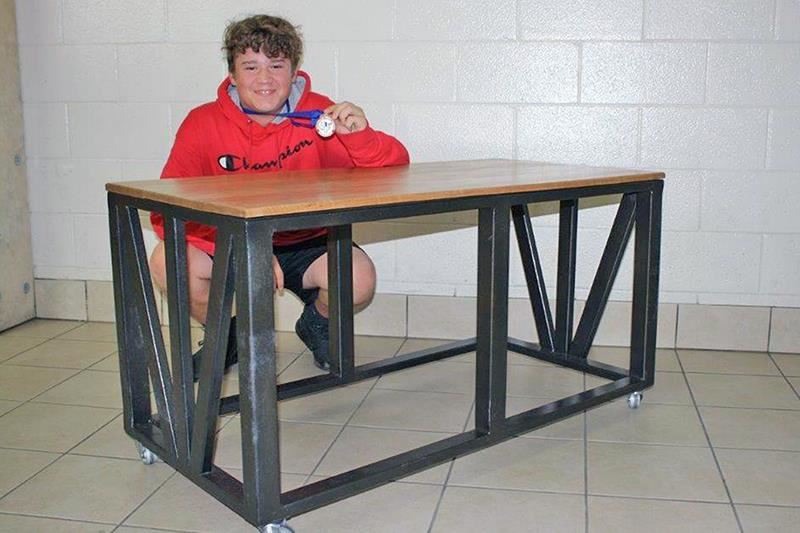Jersey Village High School freshman Tommy King poses with his project that placed first in Manufacturing Metals – Beginner.